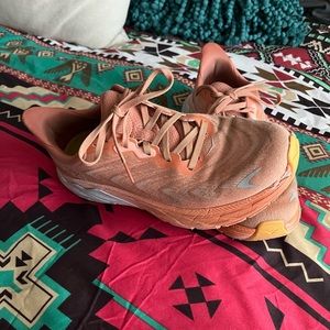 Women’s Hoka. Arahi 6.  Size 8.5. Light Orange and white. Some wear.